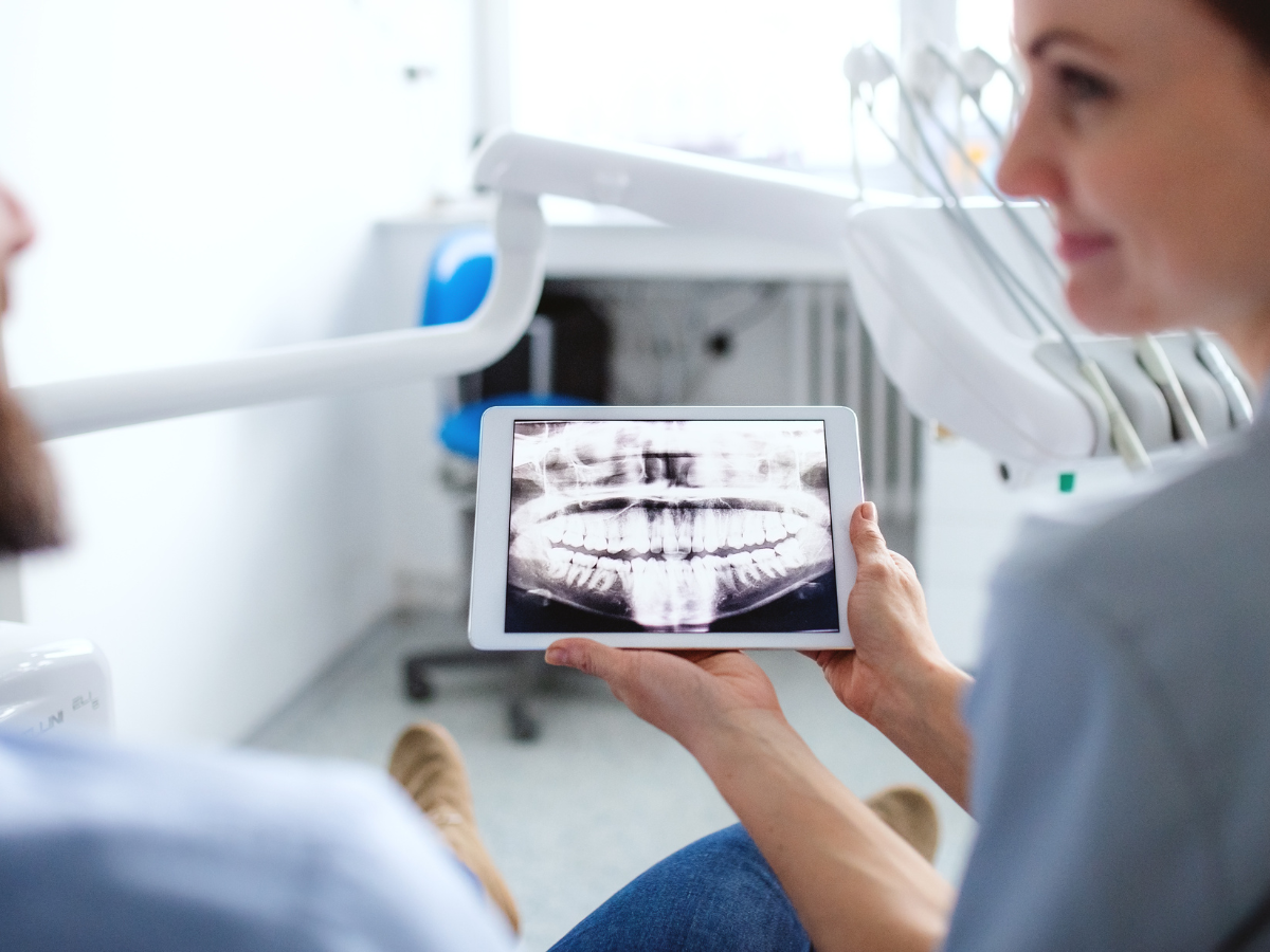 Dentist on Avenue Rd analyzing digital X-rays North Toronto Dental Centre